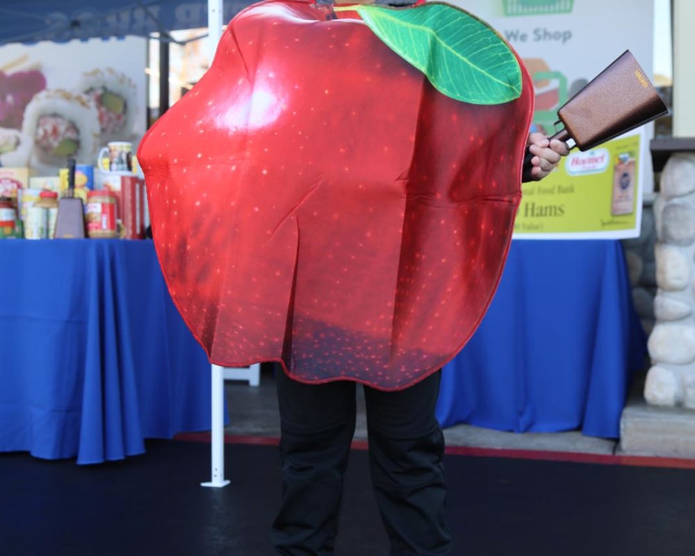 Young man in apple costume at KTLA take 5 to care