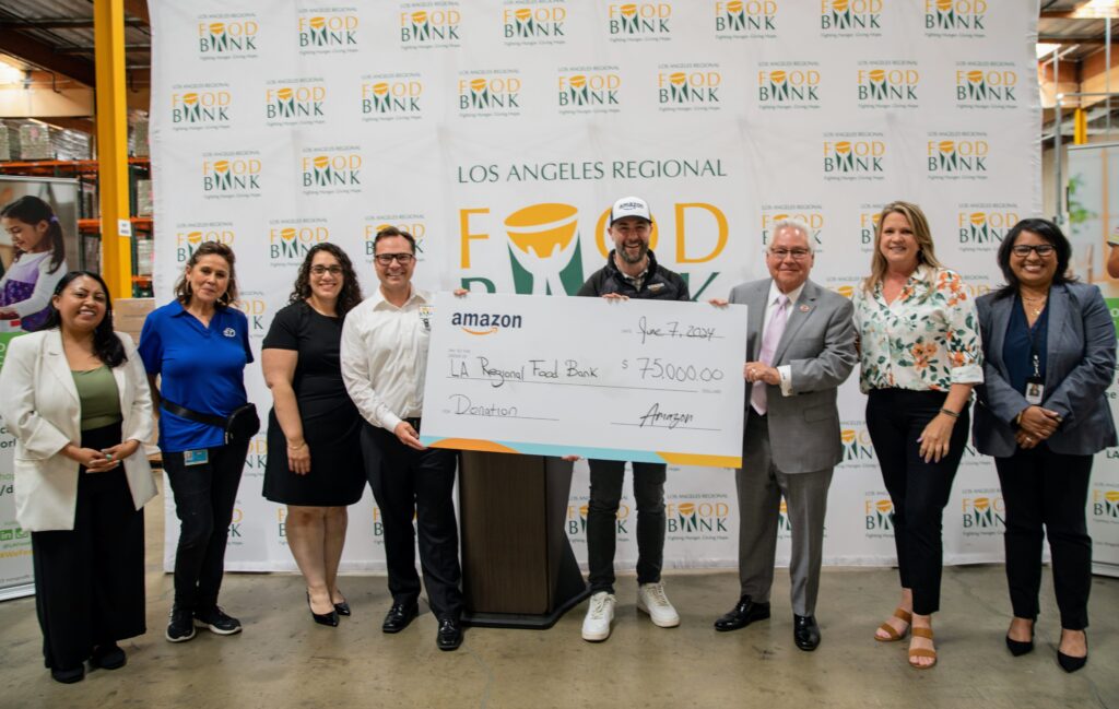 Amazon presents the Food Bank with a $75,000 donation.