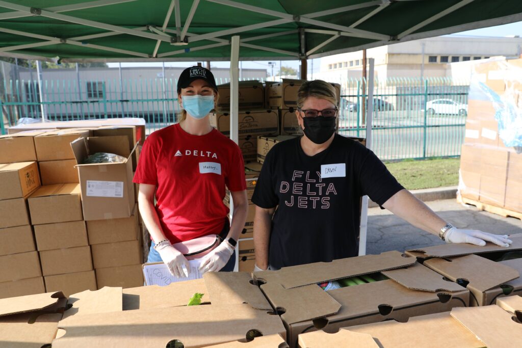 Two Delta workers volunteering with the Food Bank