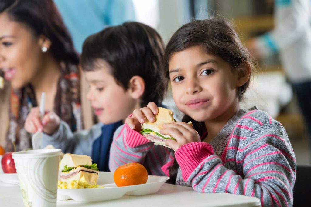 young girl eating lunch